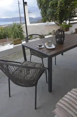 a picnic table with a plate of food on it at Casa Vista in Kissamos