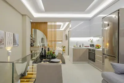 a kitchen and living room with a glass table at Nicole Studio in Center Chania in Chania Town