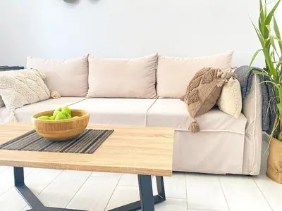 a living room with a couch and a coffee table at NICOL's HOUSE in Chania Town
