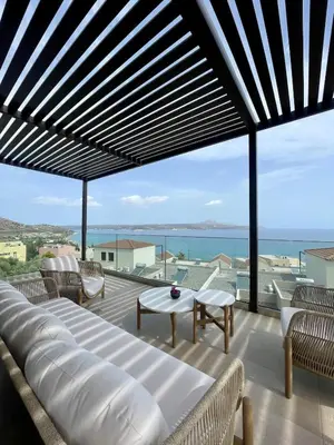 a balcony with a view of the ocean at Luxury Sunset Villa with Private Pool & Sea Views in Kalyves