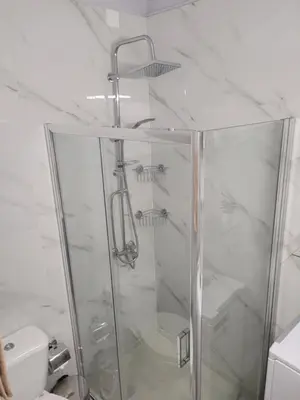 a shower with a glass door in a bathroom at Cretan Dream in Chania Town