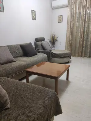 a living room with couches and a coffee table at Georgia apartment in Chania Town