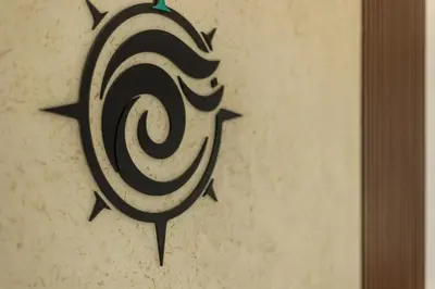 a painting of a spiral on a wall at VENTUS Luxury Suites in Khóra Sfakíon