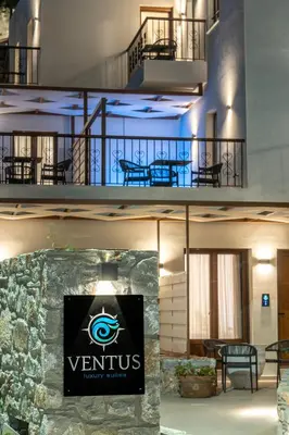 a building with a sign that says venus luxury suites at VENTUS Luxury Suites in Khóra Sfakíon