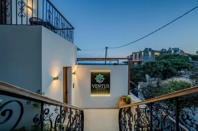 a sign on the side of a building at VENTUS Luxury Suites in Khóra Sfakíon