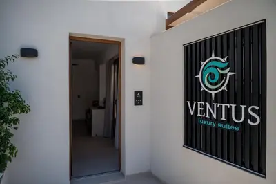 a sign on the side of a building at VENTUS Luxury Suites in Khóra Sfakíon