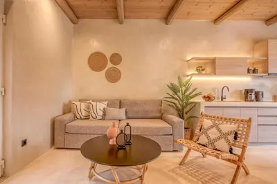 a living room with a couch and a table at Christini Secrets in Plátanos