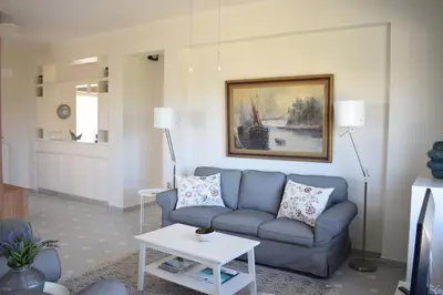 a living room with a couch and a table at Verano Retreat in Chania Town
