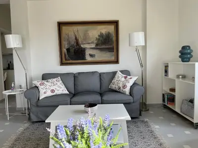 a living room with a couch and a table at Verano Retreat in Chania Town