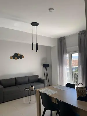 a living room with a couch and a table at Kidonias apartment in Chania Town
