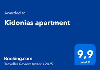 a blue sign with the text awarded to kalamias apartment at Kidonias apartment in Chania Town
