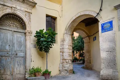 an entrance to a building with a door and a tree at In Heart of Old Town w. Venetian Port Views in Chania Town