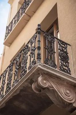 an ornate balcony on the side of a building at Copal Simple Staying in Chania Town
