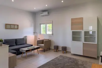 a living room with a couch and a table at Villa Adam in Chania Town