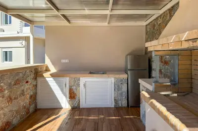 a kitchen with a counter and a refrigerator at Villa Adam in Chania Town