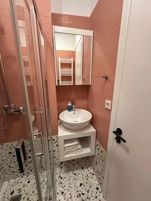 a bathroom with a sink and a shower at Stefania's House in Chania Town