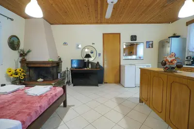 a large room with a kitchen and a living room at Paradise Lost in Gerani Chanion