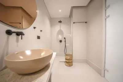 a bathroom with a large bowl sink on a counter at Amelia Luxury Suites Old Town in Chania Town