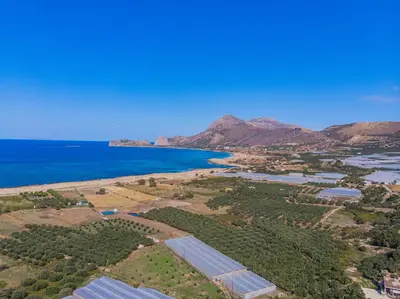 an aerial view of the ocean and a town at Villa Smaragdi - Private Sea View Villa in Falasarna