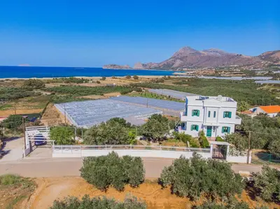 an aerial view of a building with a tennis court at Villa Smaragdi - Private Sea View Villa in Falasarna
