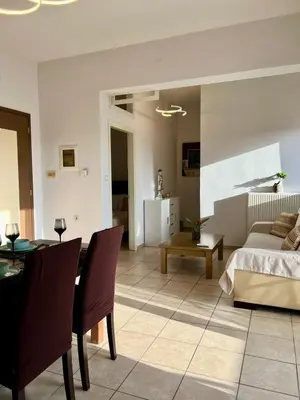 a living room with a bed and a table at Stratos Apartment in Chania Town