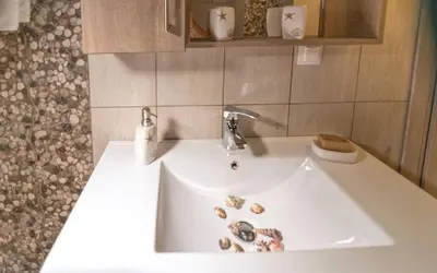 a bathroom sink with a faucet on top of it at Xirouchakis farm2 in Kissamos