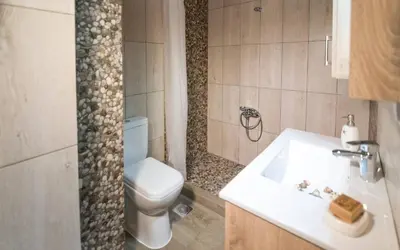 a bathroom with a white toilet and a sink at Xirouchakis farm2 in Kissamos