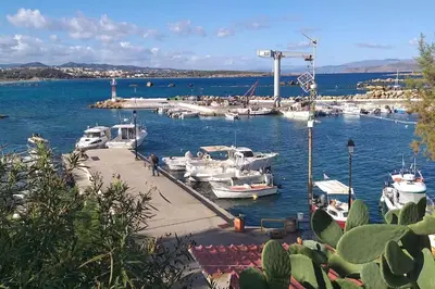a group of boats docked at a marina on the water at Ferienwohnung am Meer Belle Vue in Chania Town