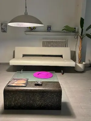 a living room with a pink frisbee on a table at SQUARE 45 in Chania Town