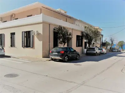 a car parked in front of a building on a street at SQUARE 45 in Chania Town