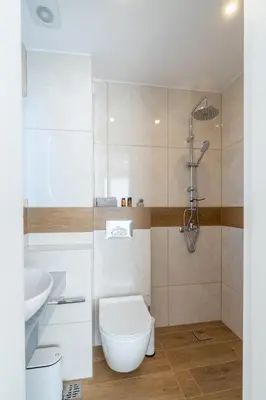 a bathroom with a toilet and a sink at Odyssey Residences in Chania Town