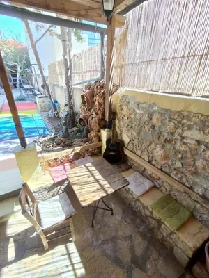 a room with a couch and chairs and a table at Chania Hostel Youth 18-50 in Chania Town