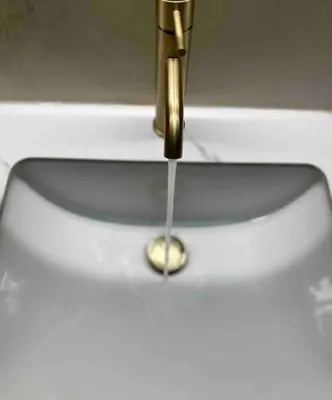 a water dripping from a faucet on a toilet at Linear Flat - City Center - Private Parking in Chania Town