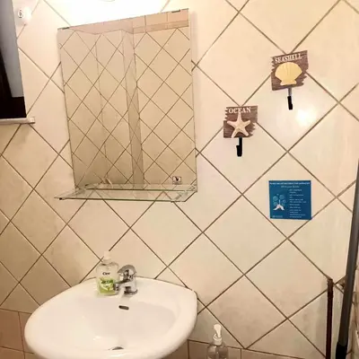 a bathroom with a sink and a mirror at Mamouth Studios in Chania Town
