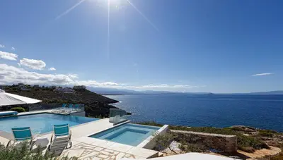 a swimming pool with a view of the ocean at Villa Chryssi in Tersanas