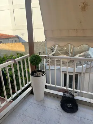 a plant in a pot sitting on a balcony at Nelly's Private Resindence in Chania Town