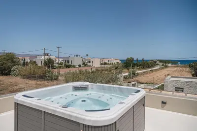 a hot tub on a balcony with a view at Villa Iocaste - With private pool and EV station in Chania Town