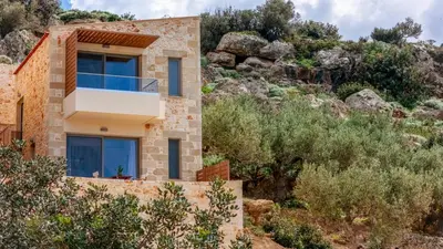 a house on the side of a mountain at Anadia Luxury Pocket Villa Infinite Sea View in Falasarna
