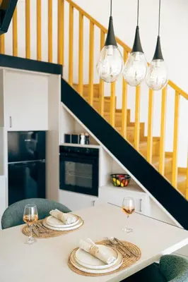 a kitchen with a table with glasses of wine at Anadia Luxury Pocket Villa Infinite Sea View in Falasarna