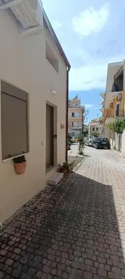 a building with a large screen on the side of it at Boschini Loft Life in Chania Town
