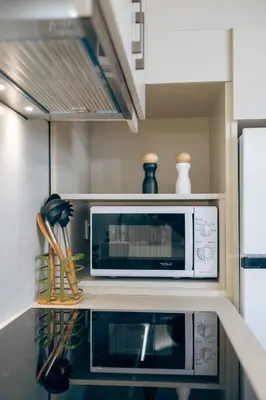 a microwave oven sitting on top of a kitchen counter at Athali Luxury Pocket Villa Stunning Sea View in Falasarna
