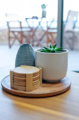 a plate with a plant in a pot on a table at Athali Luxury Pocket Villa Stunning Sea View in Falasarna
