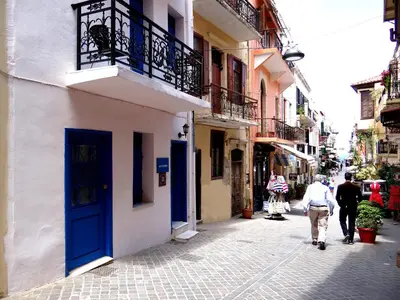 a group of people walking down a street at Villa Archondisa in Chania Town