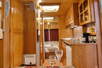a kitchen with two wine glasses on a table at Lemon Garden Camper in Chania Town