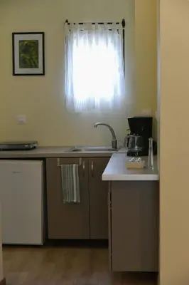 a kitchen with a sink and a window at Madrugada in Chania Town