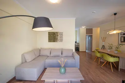 a living room with a couch and a table at Madrugada in Chania Town