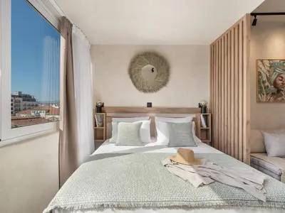 a bedroom with a bed with a hat on it at Aura Urban Living in the heart of Chania city in Chania Town