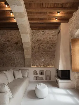 a living room with a couch and a table at Corte Interna, free heated pool in Kalivianí