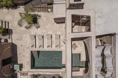 an aerial view of a building with a pool at Corte Interna, free heated pool in Kalivianí