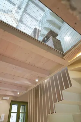 a glass ceiling in a house with a staircase at Mystiko Maisonette with Hot Tub - Chania Old Town in Chania Town